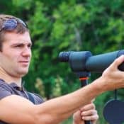 someone is holding a scope