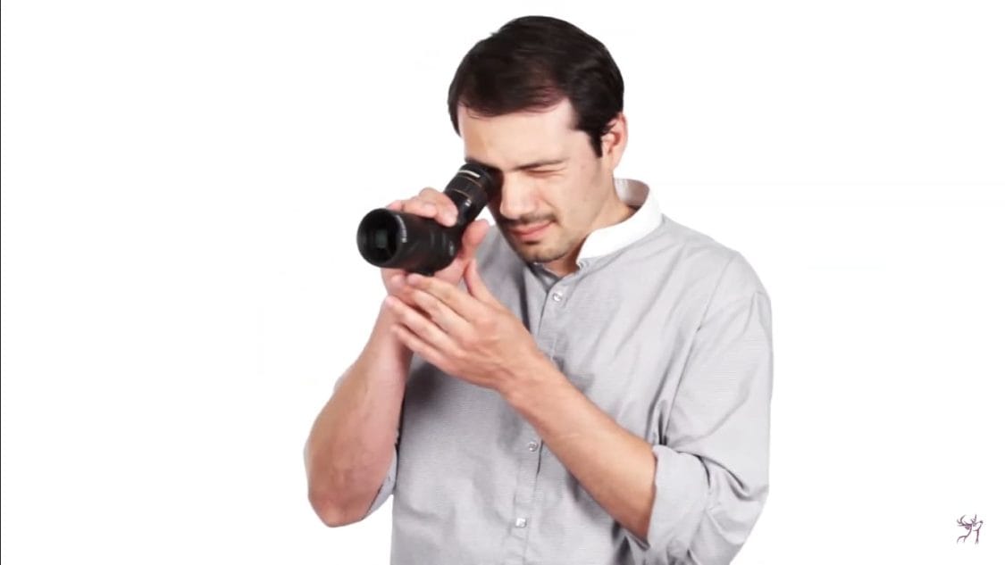 someone is holding a scope